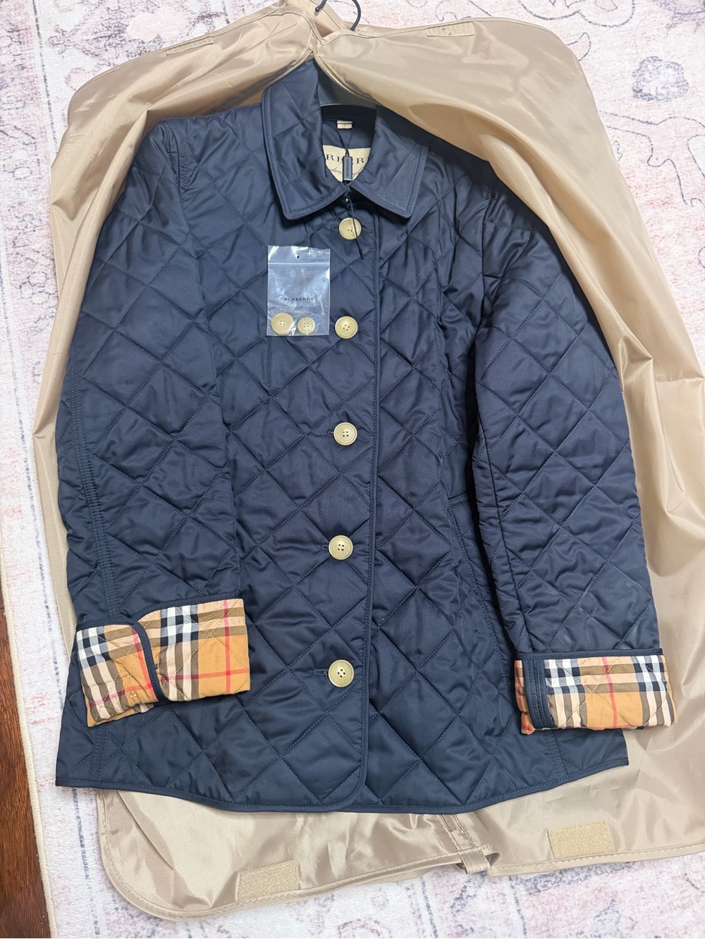 Burberry Navy Quilted Jacket with Check Cuff Detail